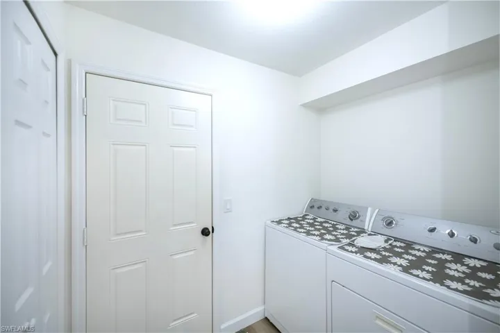Laundry room leads to the garage and has dry storage pantry