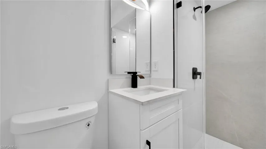 Half bath with vanity and toilet