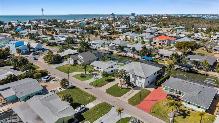View of property location featuring a nearby body of water and nearby suburban area