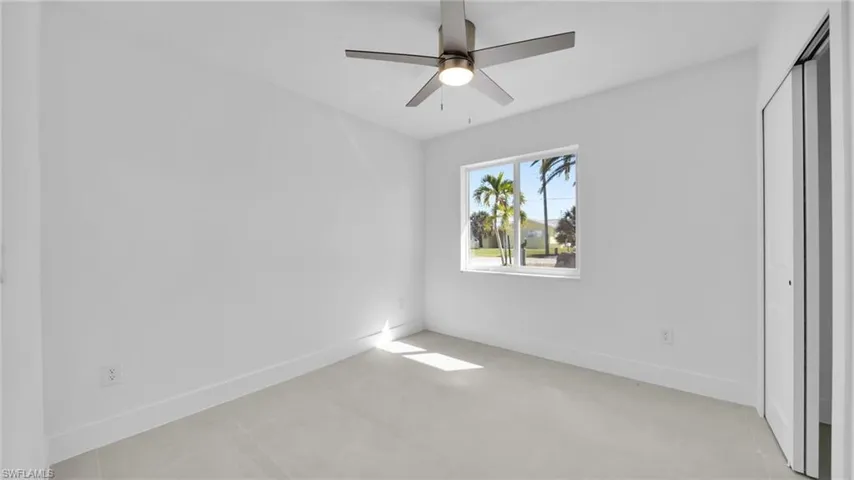 Unfurnished bedroom featuring a closet and ceiling fan
