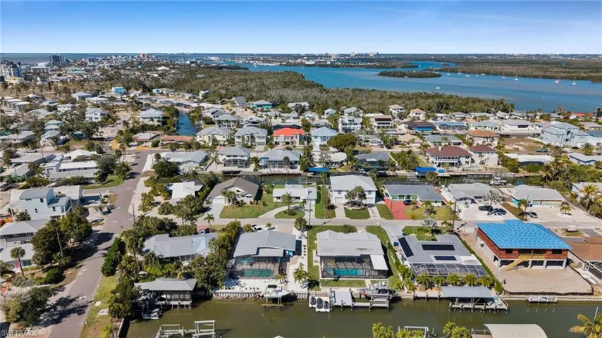 View of property location with a large body of water and nearby suburban area