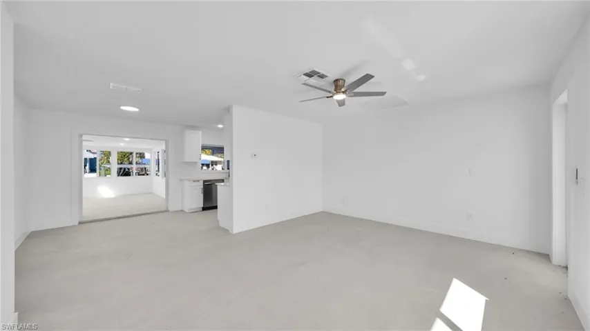 Spare room featuring ceiling fan, concrete flooring, and recessed lighting