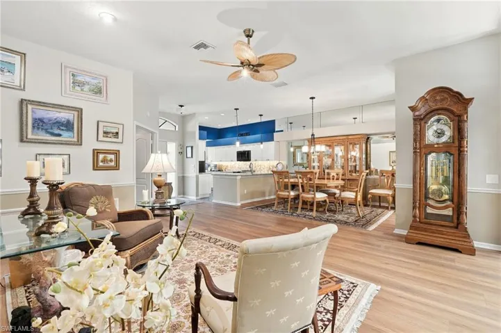 Open-concept living area with wood-finish flooring