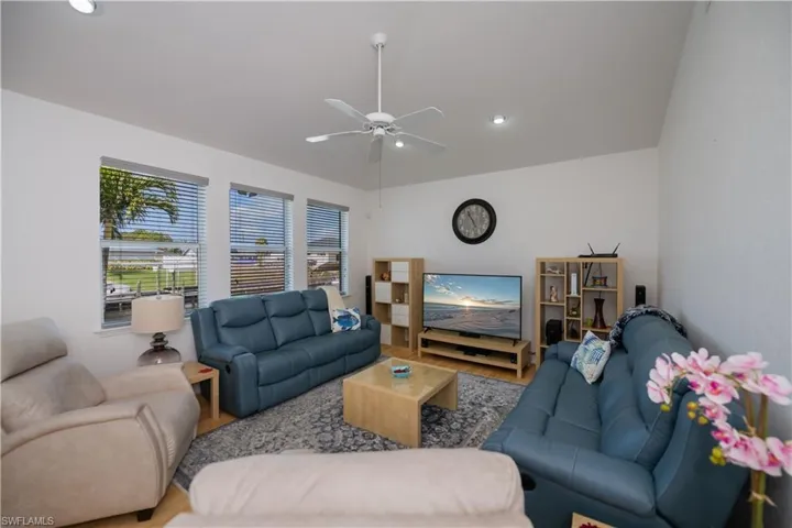 Family room area featuring ceiling fan and wood finished floors