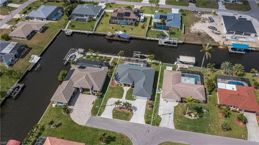 Drone / aerial view featuring a water view and a residential view