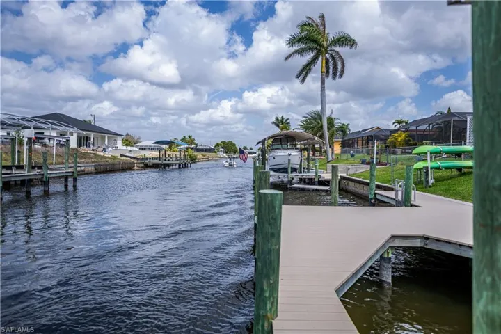 Dock area featuring a water view and a residential view