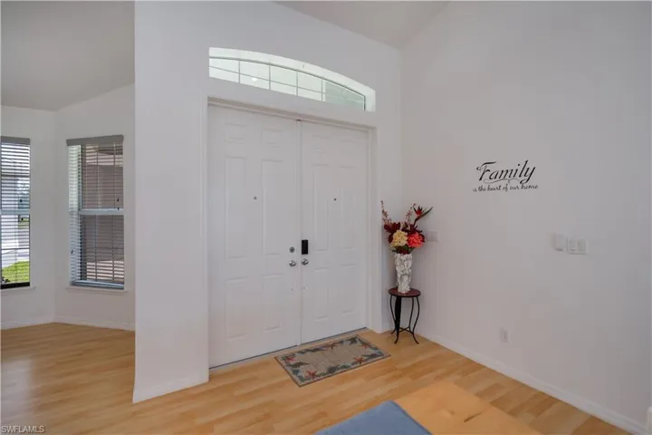 Entrance foyer featuring light wood-type flooring, plenty of natural light