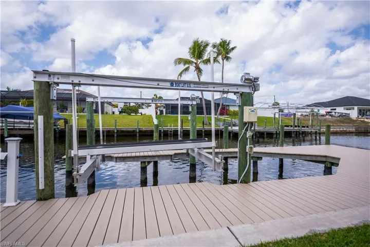 View of dock featuring a water view and boat lift