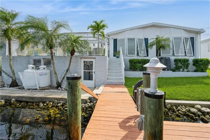 View of dock with a yard