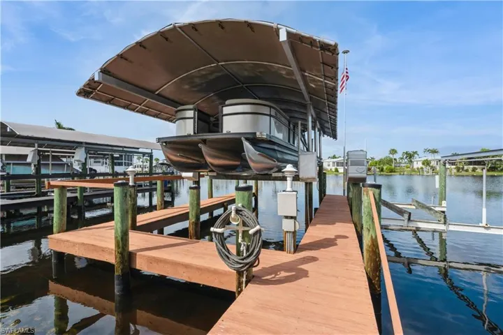 Dock area featuring a water view