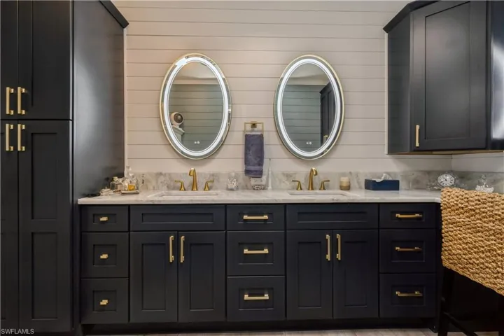 Bathroom with wood walls and vanity