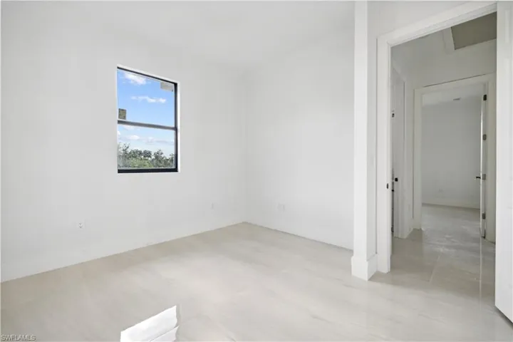 Spare room featuring light tile floors