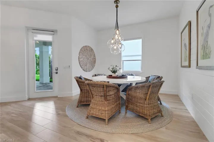 Dining room with light hardwood / wood-style floors