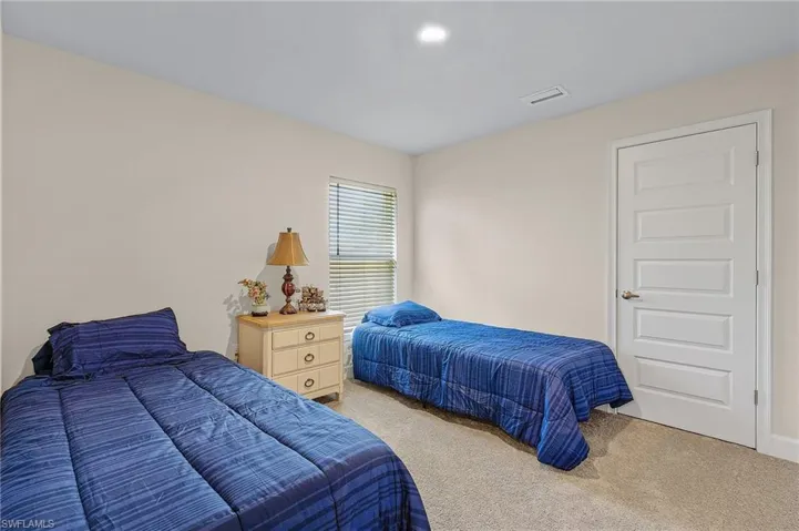 View of carpeted guest bedroom