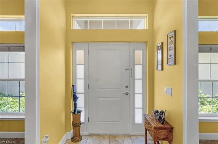 Entryway featuring light tile floors