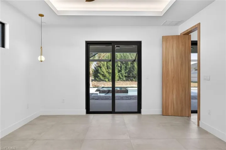 Spare room with concrete floors and baseboards