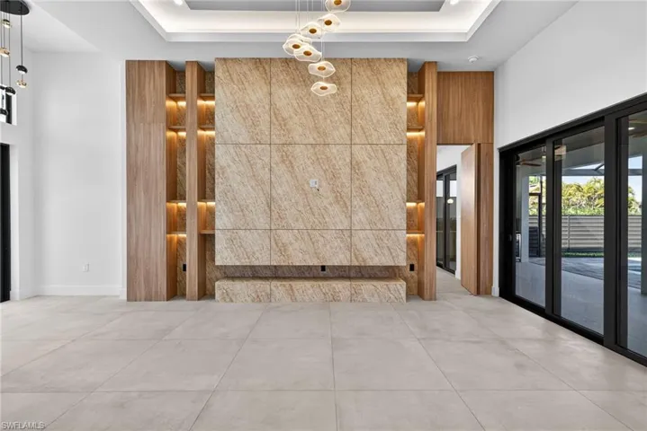 Common area with a tray ceiling