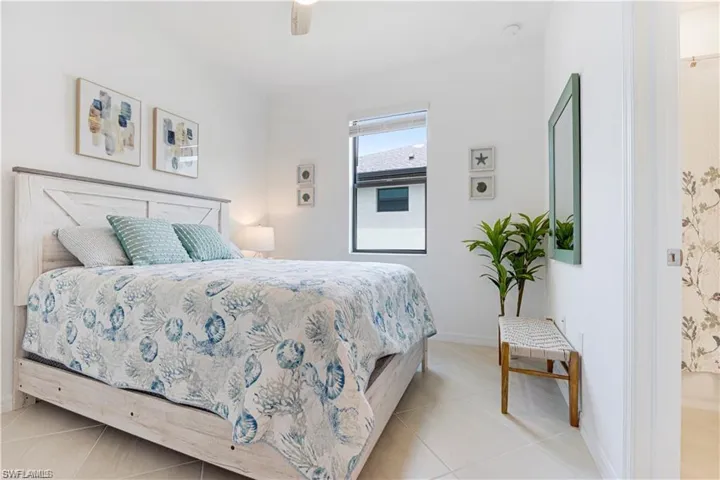 Neutral white walls complement light-toned tile flooring