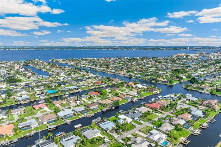 Aerial view of residential area with a nearby body of water