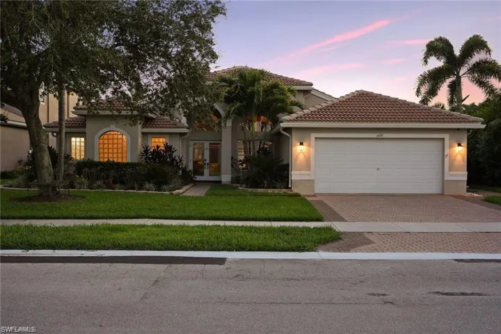 One-story residence with a court yard and a garage