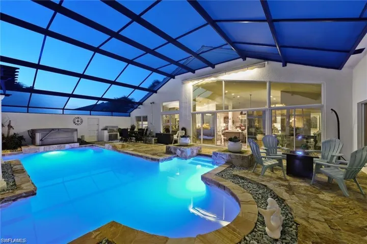 View of pool featuring a patio and a lanai