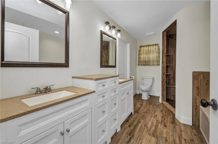 Primary Bathroom with dual sinks, large walk-in shower & jetted tub