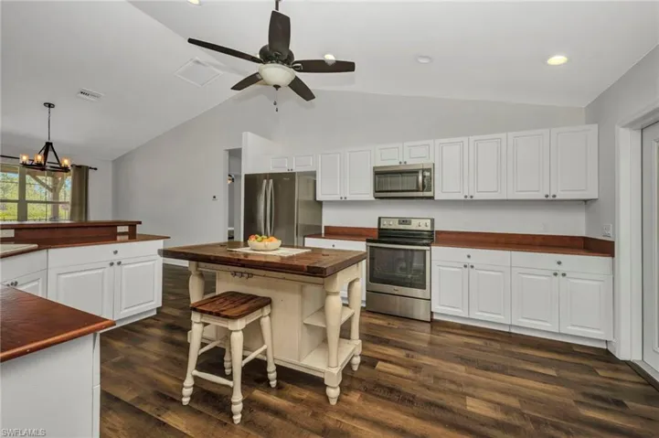 Kitchen with Vaulted Ceiling, Recessed Lighting, Center Island, Plenty of Cabinets
