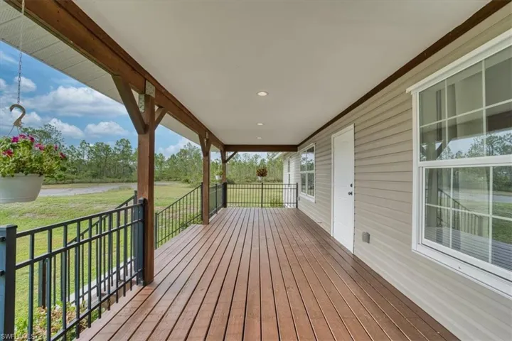 Charming Front Porch Ideal for Morning Coffee or Evening Sunsets