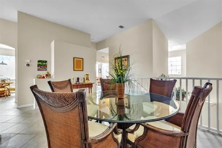 Dining area featuring baseboards and light tile patterned flooring