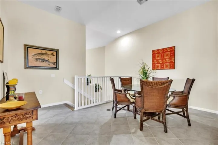Dining area featuring recessed lighting and light tile patterned floors