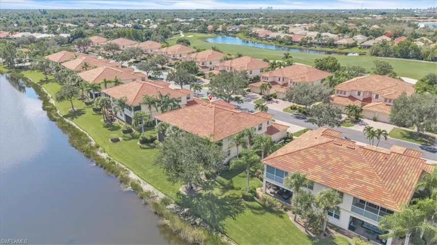 Aerial view of residential area featuring a large body of water