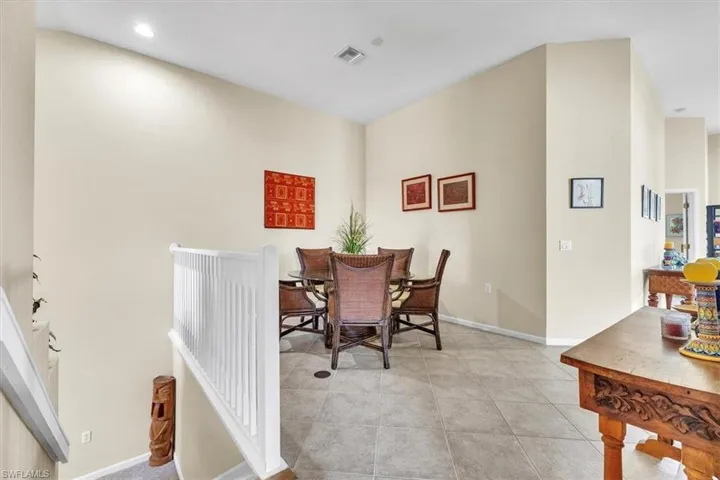 Dining space featuring light tile patterned flooring and recessed lighting