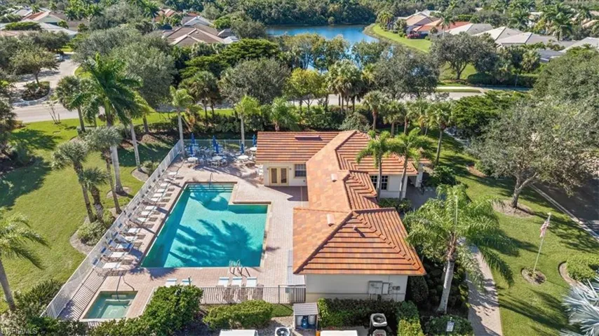 Drone / aerial view of a large body of water and a pool area