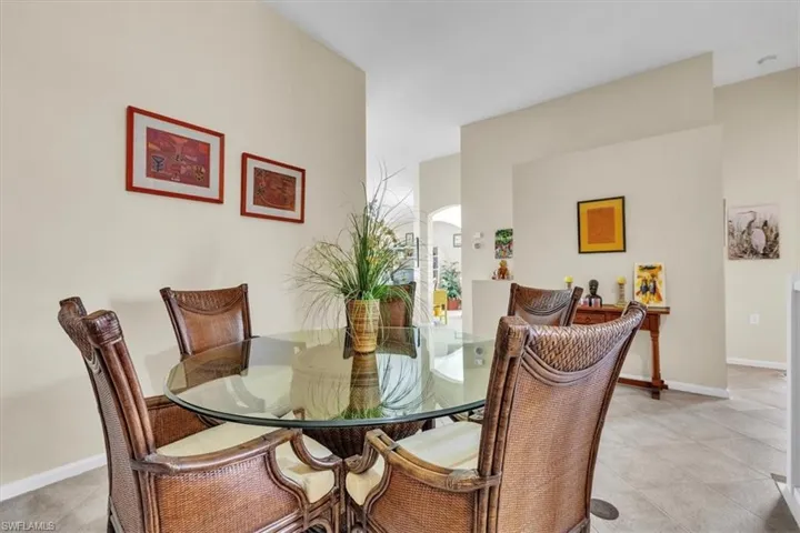 Dining space featuring baseboards and light tile patterned floors