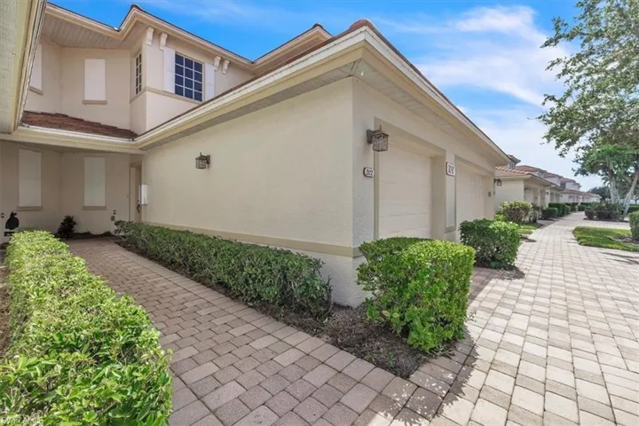 View of home's exterior featuring stucco siding and a garage