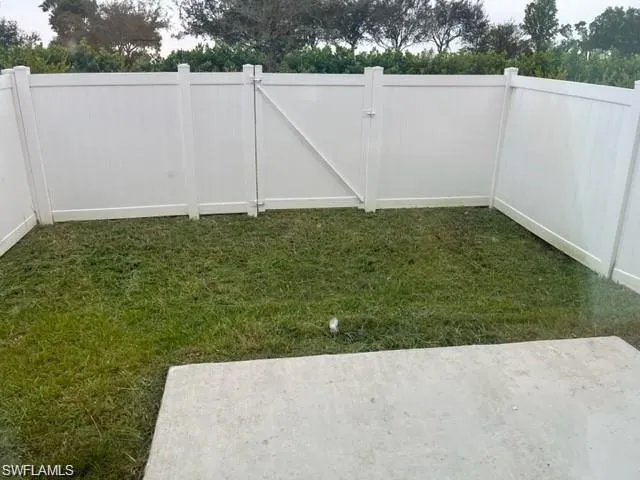 View of yard featuring a gate