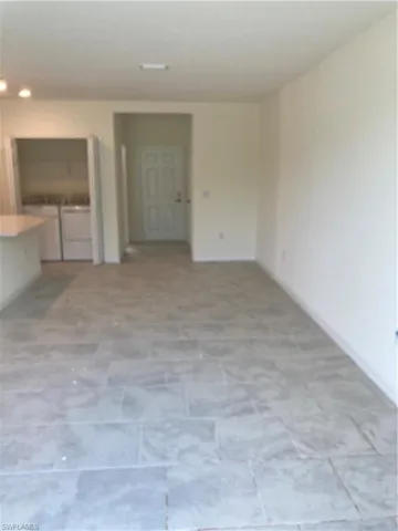 Spare room featuring independent washer and dryer