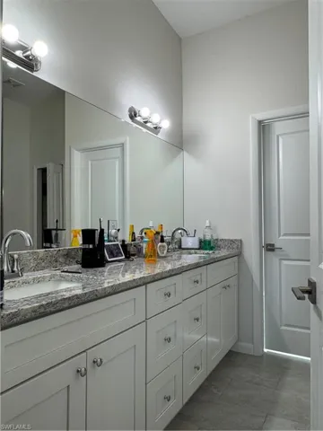 Full bathroom featuring double vanity
