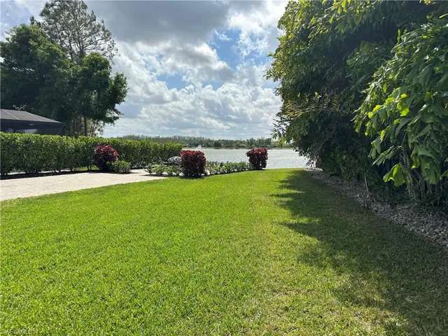 View of grassy yard featuring a water view
