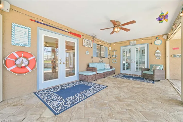 View of patio / terrace featuring french doors and a ceiling fan