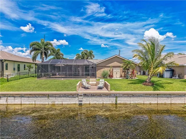 Rear view of house featuring a water view