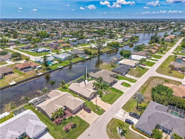 Aerial overview of property's location featuring nearby suburban area and a large body of water