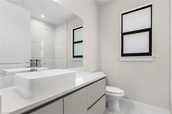 Bathroom featuring vanity and recessed lighting