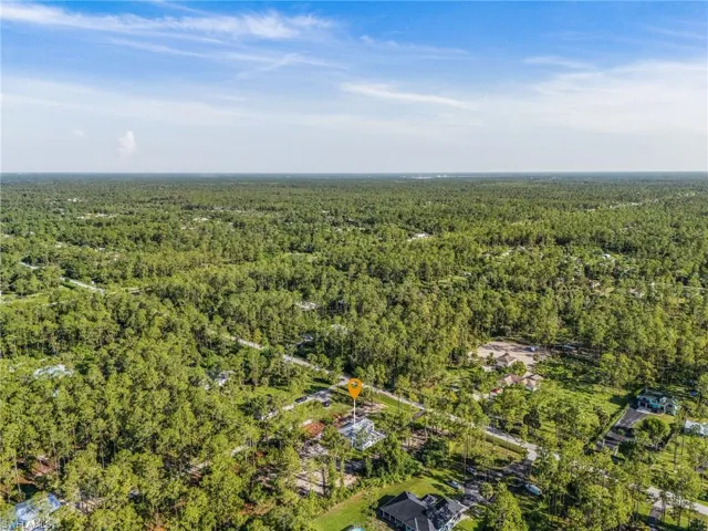 View of property location featuring a forest