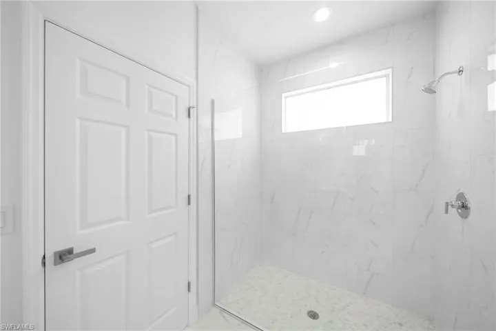 Bathroom featuring a tile shower