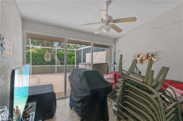 Covered lanai that opens to living room and large outdoor lanai, great place to store items when you leave.