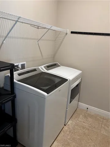 Washroom featuring separate washer and dryer