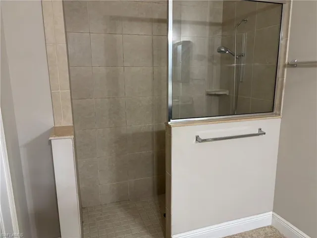Bathroom featuring a tile shower