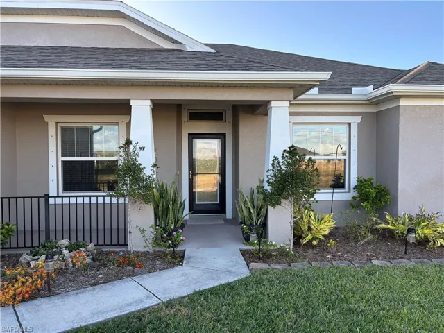 Property entrance with covered porch