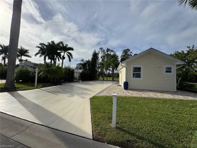 View of home's exterior featuring a lawn